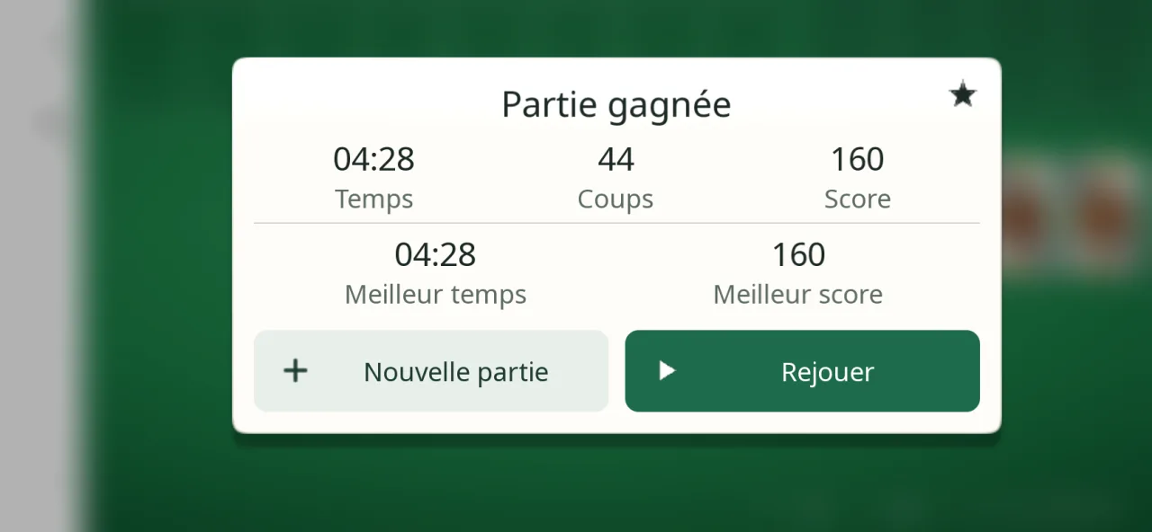 Fenêtre Partie gagnée de FreeCell Solitaire : temps, coups et score de la partie, meilleur temps et meilleur score, boutons Nouvelle partie et Rejouer.